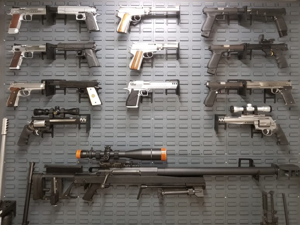 Custom Gun Wall Display with Pistols and 50 cal