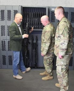 Tom Kubiniec in an armory with the U.S. Military