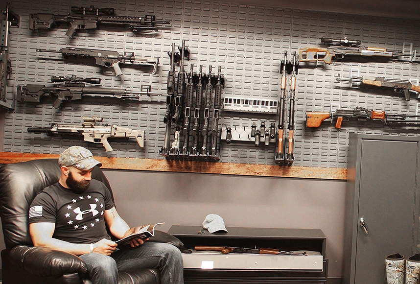 man sitting in gun room